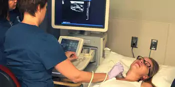 Cardiovascular Sonography students using equipment