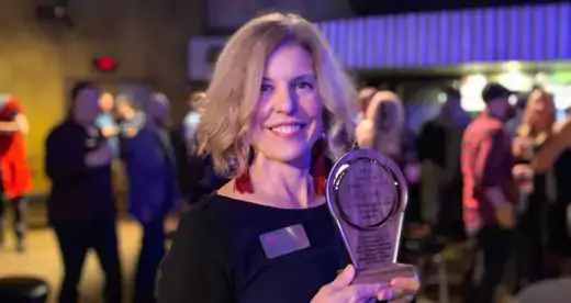 Jill Sparks holding Vanguard award