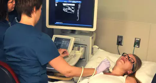 Cardiovascular Sonography students using equipment