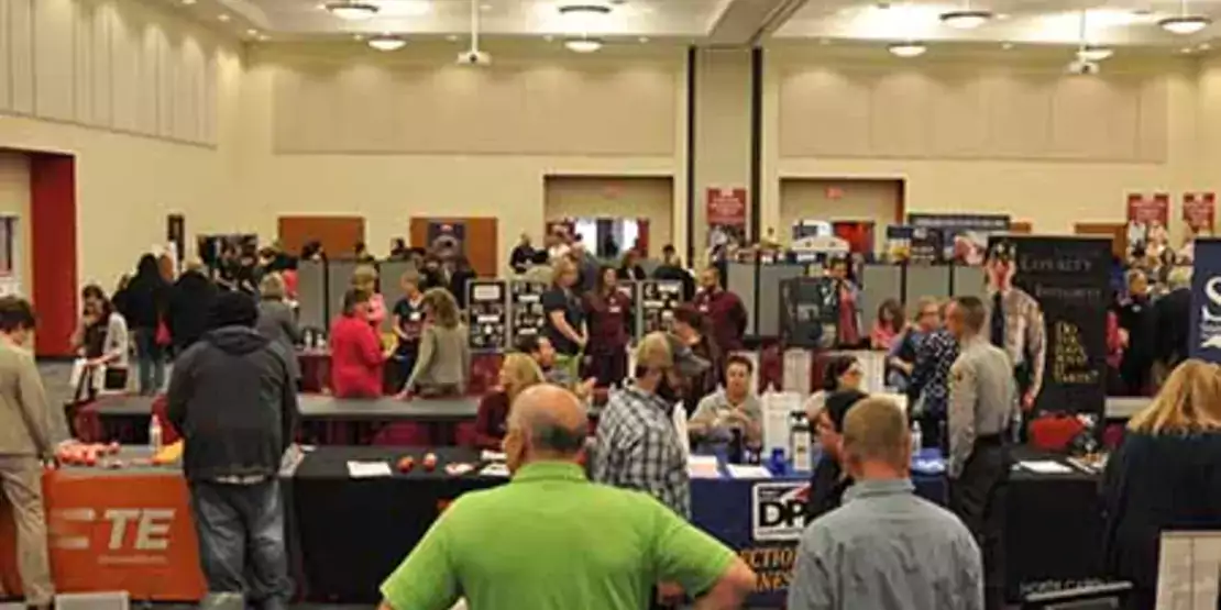 View of rows of booths at Find Your Future Open House