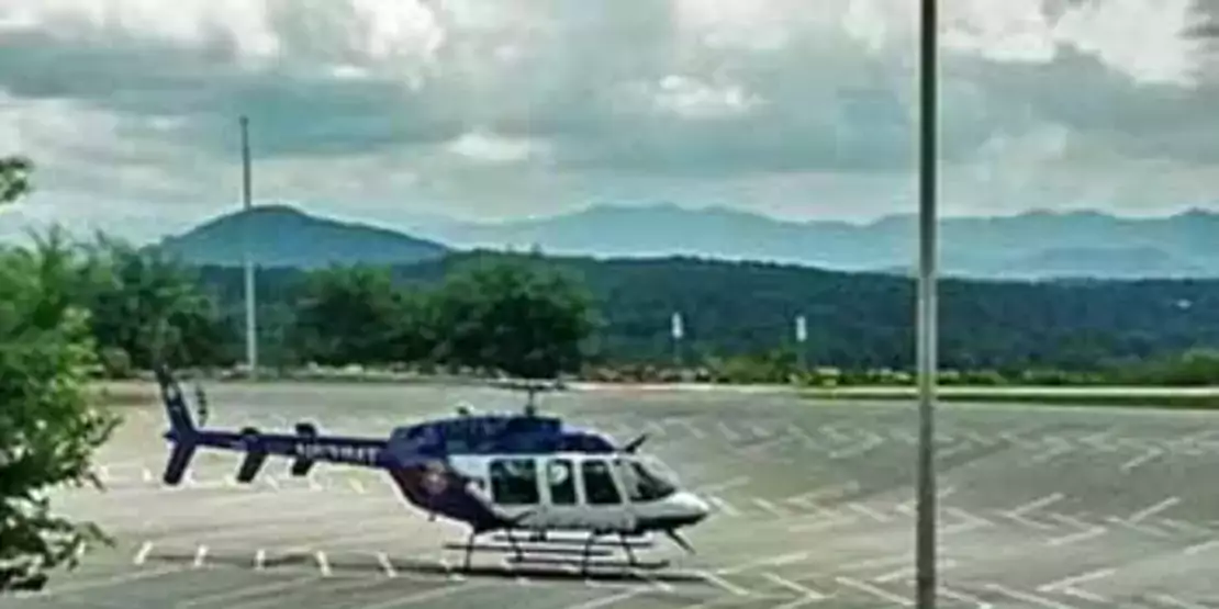 Helicopter on asphalt parking lot