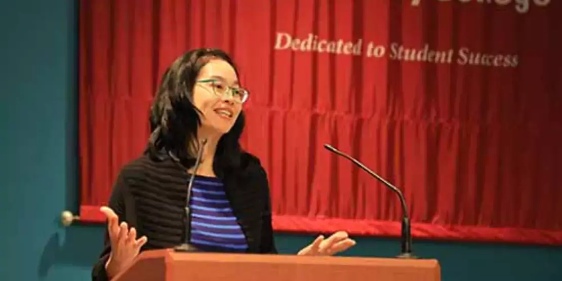 Jennie Liu behind a lectern