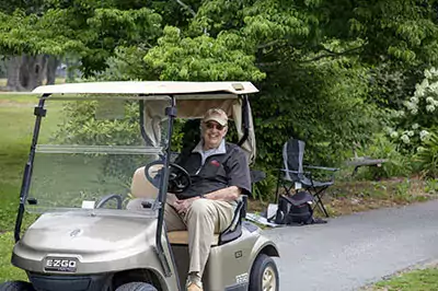 Golf Tournament Ray Bailey in Golf Cart