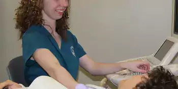 woman performing sonography